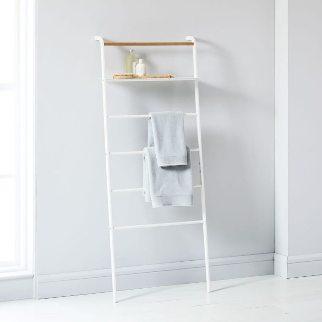 white towel rack with ladder shelving