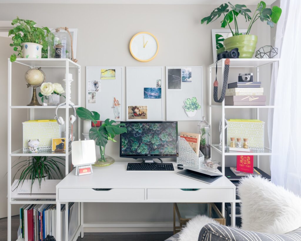 a maximalist home office with shelving