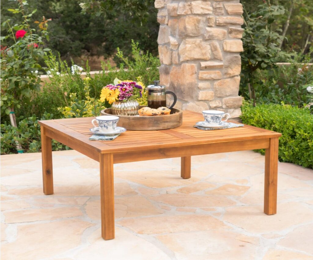 a light wooden table for patio furniture
