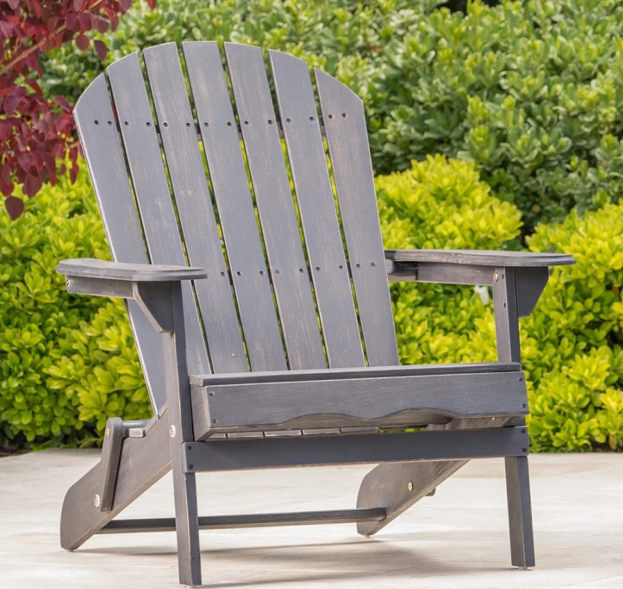 a grey stained wooden folding Adirondack chair
