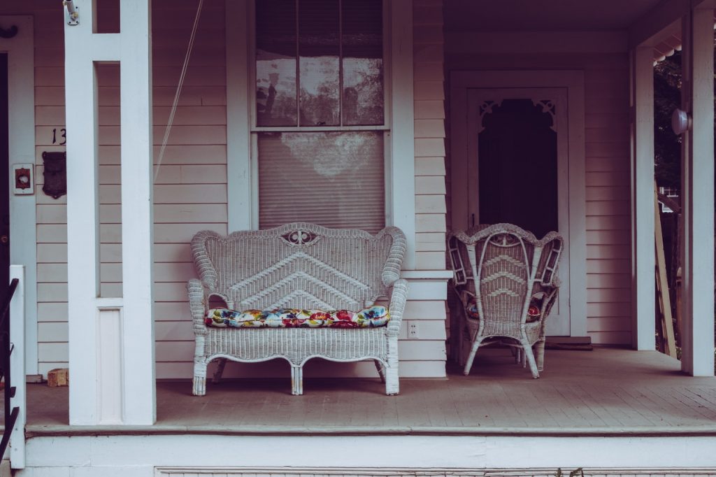front porch with wicker furniture