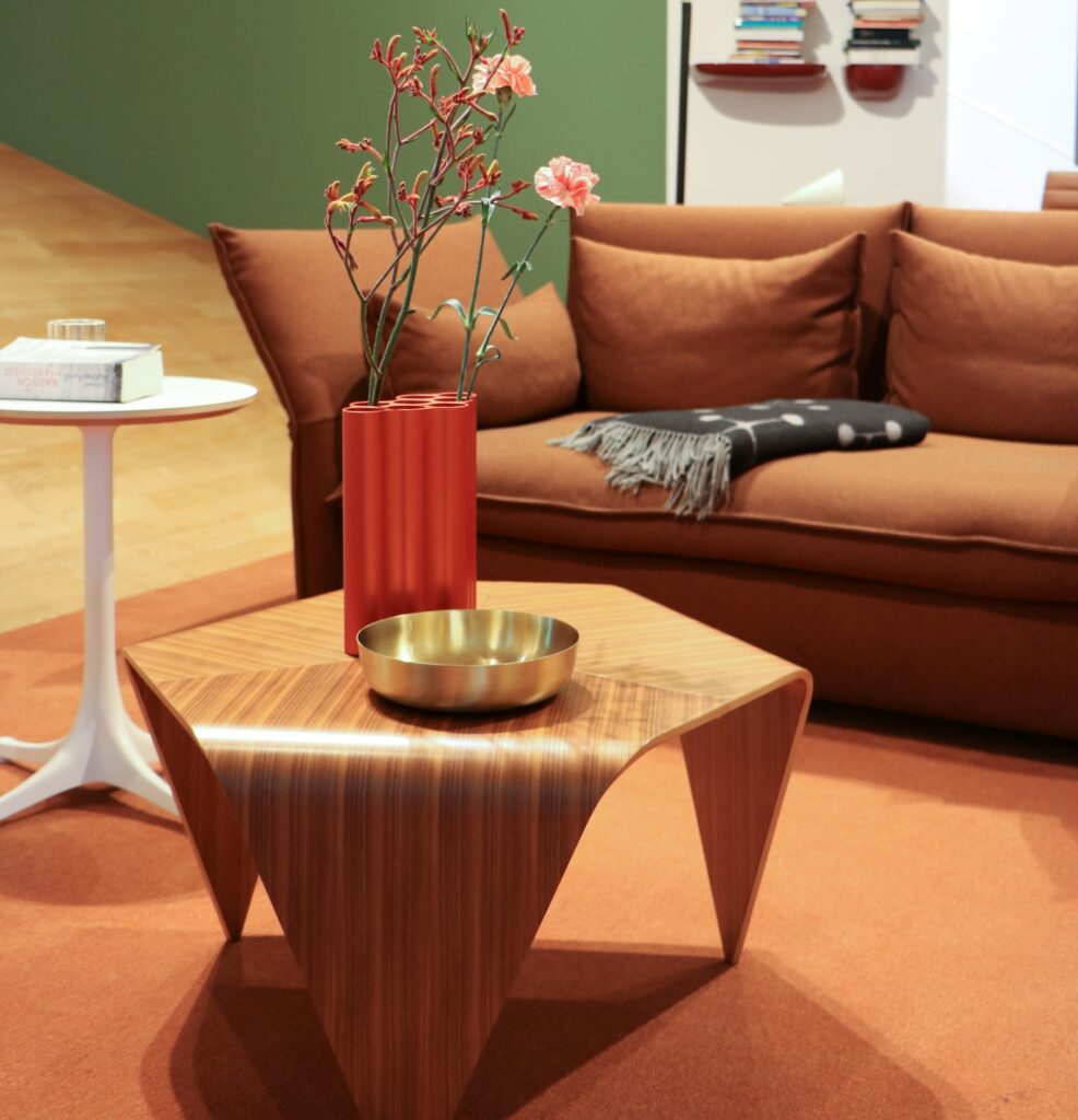 a unique wooden coffee table in a  midcentury modern living space