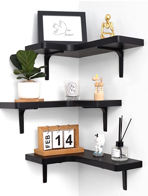 three black corner floating shelves