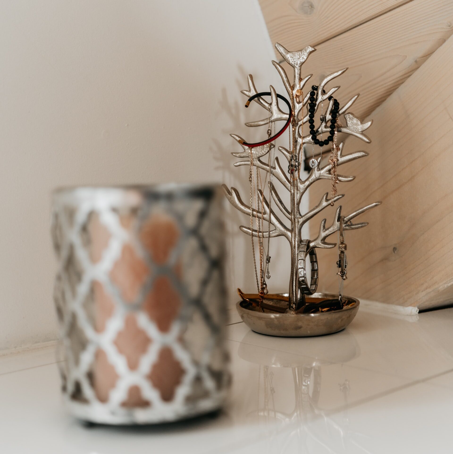 a small silver tree branch creative jewelry storage solutions