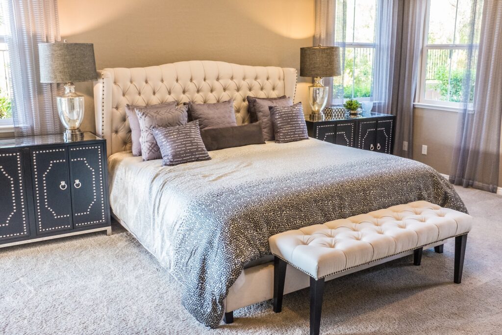a bedroom with metallic decor accents