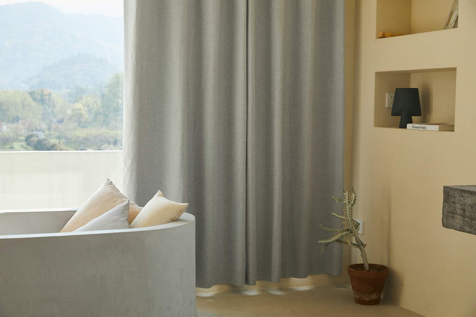 living room curtains pulled to the side of the window