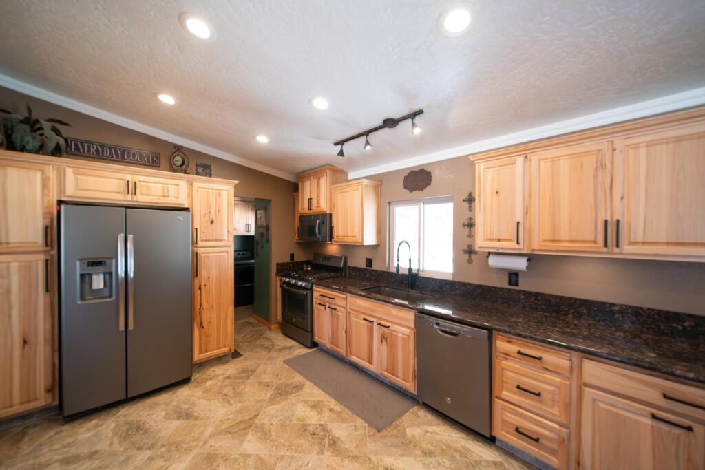 new wooden kitchen with marble counters
