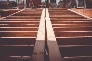 what to do if a contractor overcharges you - Beams of a house under construction
