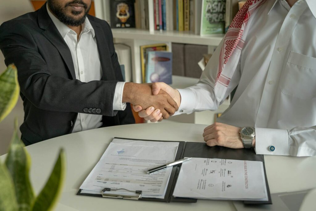 Businessmen shaking hands. One of the advantages of living in a city.