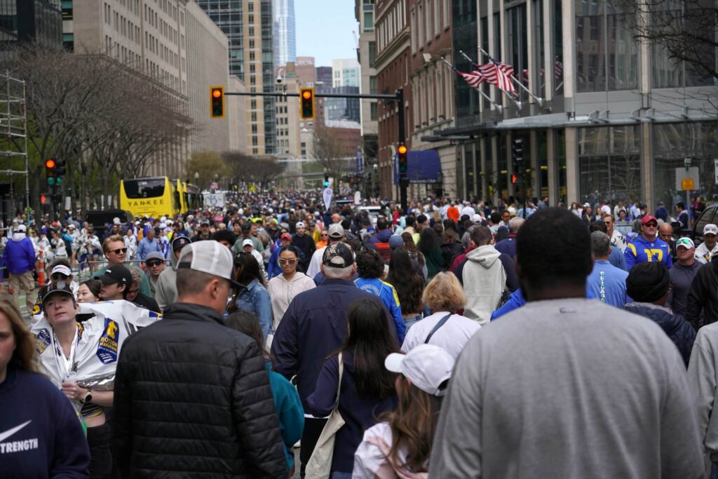 Large population of people walking. 
