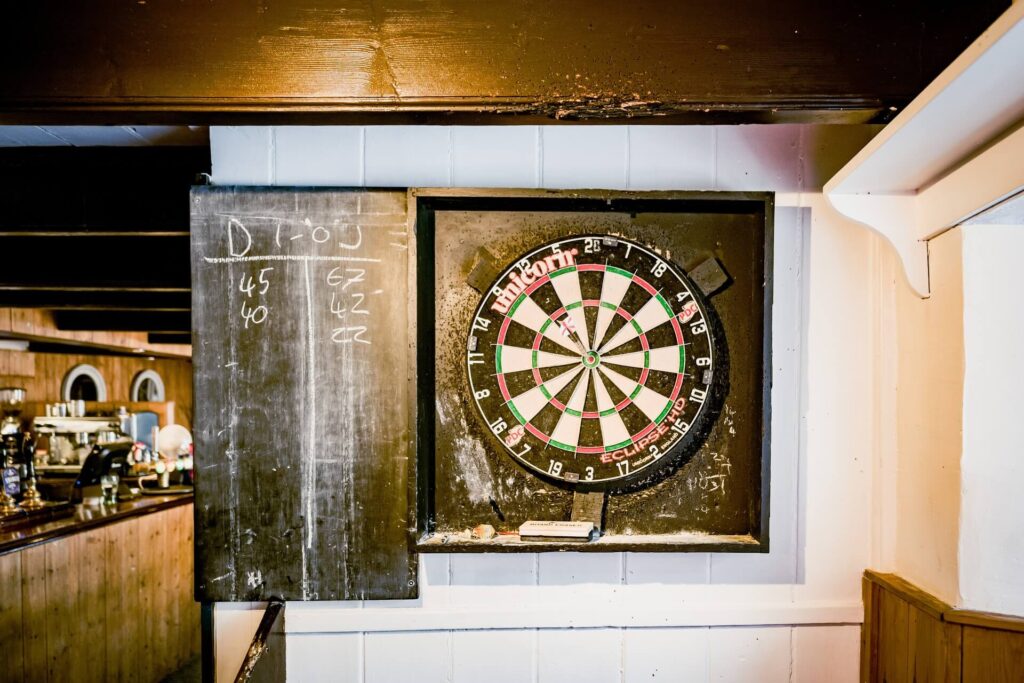 A bar's dartboard and scoreboard