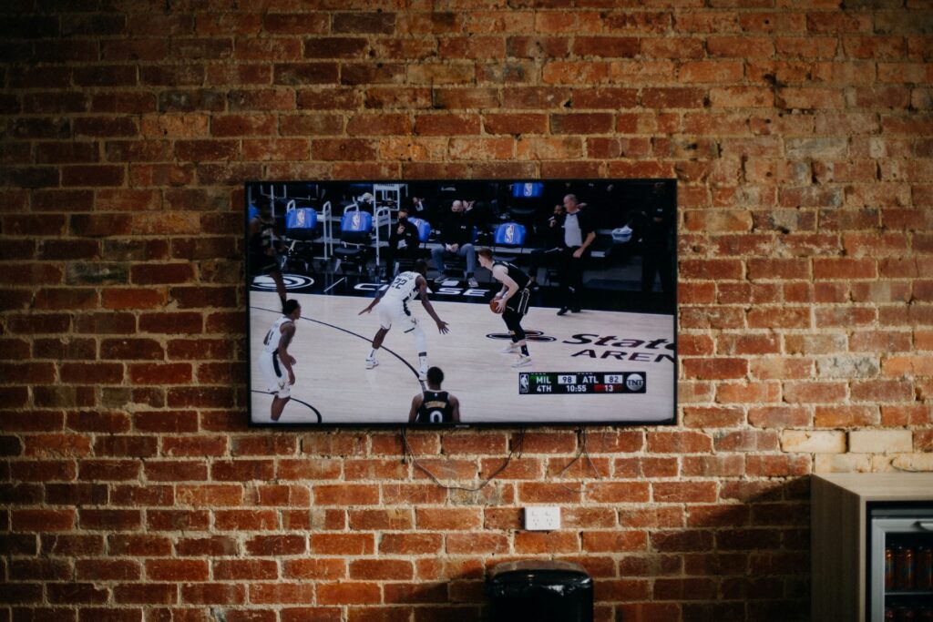 Basketball game playing on TV screen