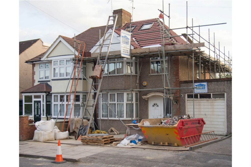 A house undergoing roof replacement.