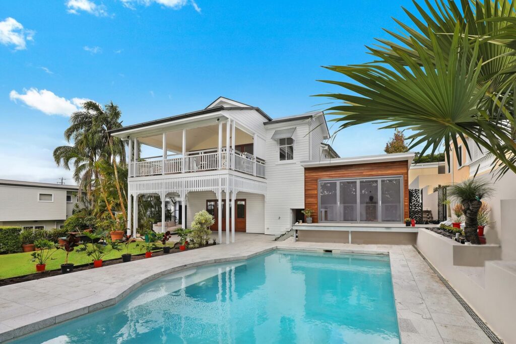 A single-family house with a pool and a backyard.