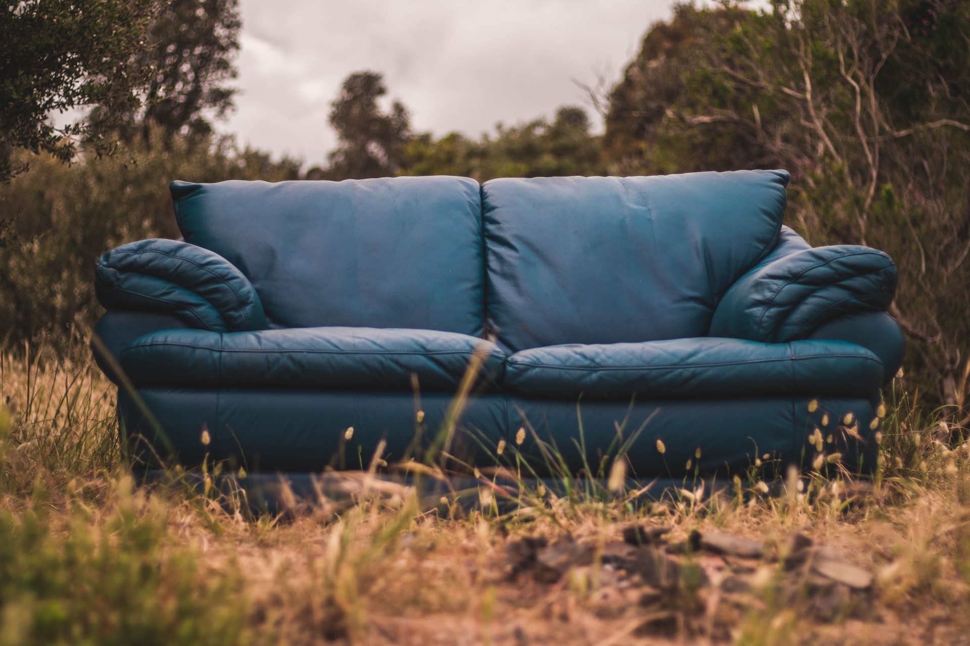 A couch sitting outside