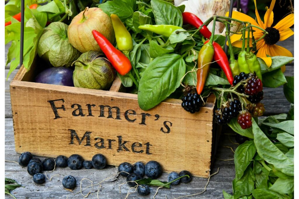 A box of fresh produce labeled Farmer's Market.