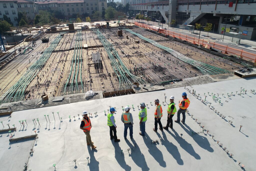 Seven construction workers in a building site located in Contra Costa Centre, California.