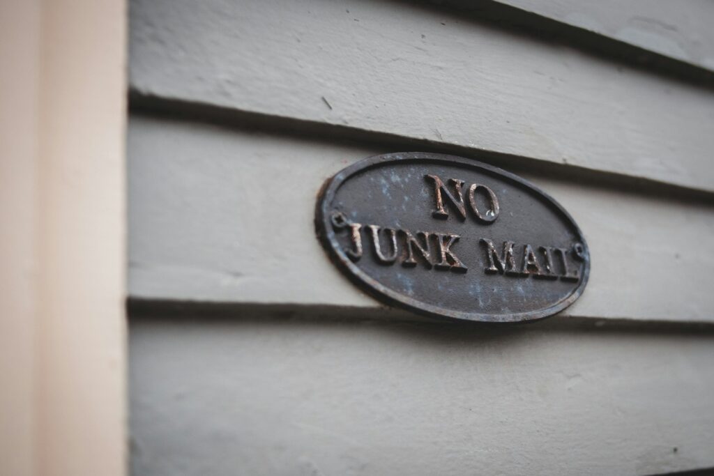 Building sign that says no junk mail