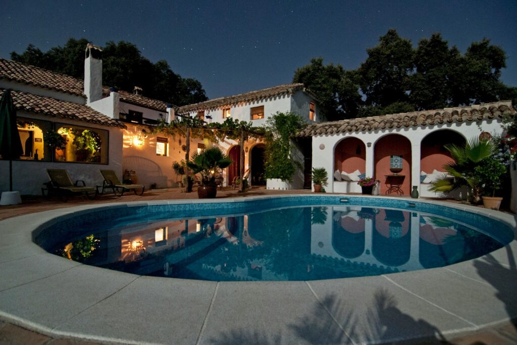 A pool at a villa at night