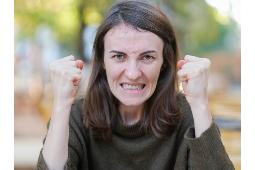 A portrait of an angry female homeowner.