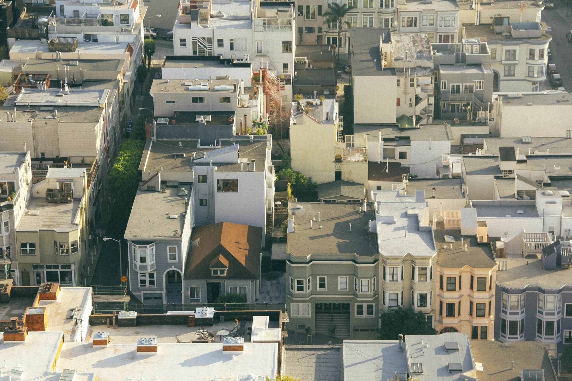 A drone shot of low-rise buildings with black and white EPDM roofing systems.