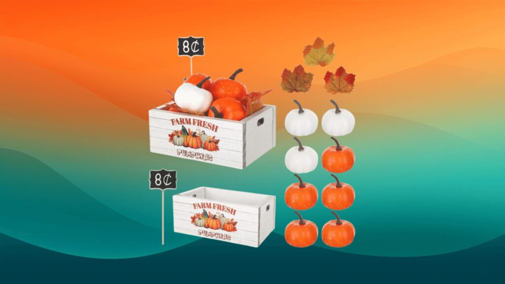 wooden pumpkin decor with two boxes, several white and orange pumpkins, and some leaves in front of an orange and teal background