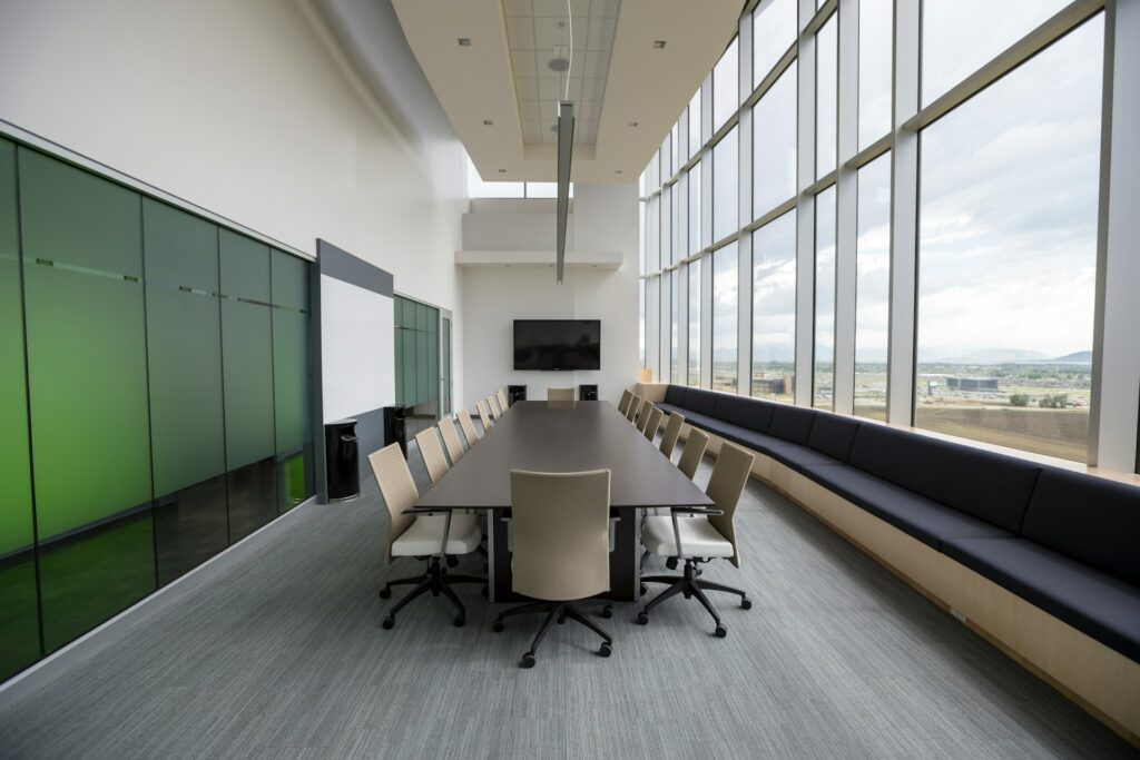 Conference Room With Large Windows and a Green Wall