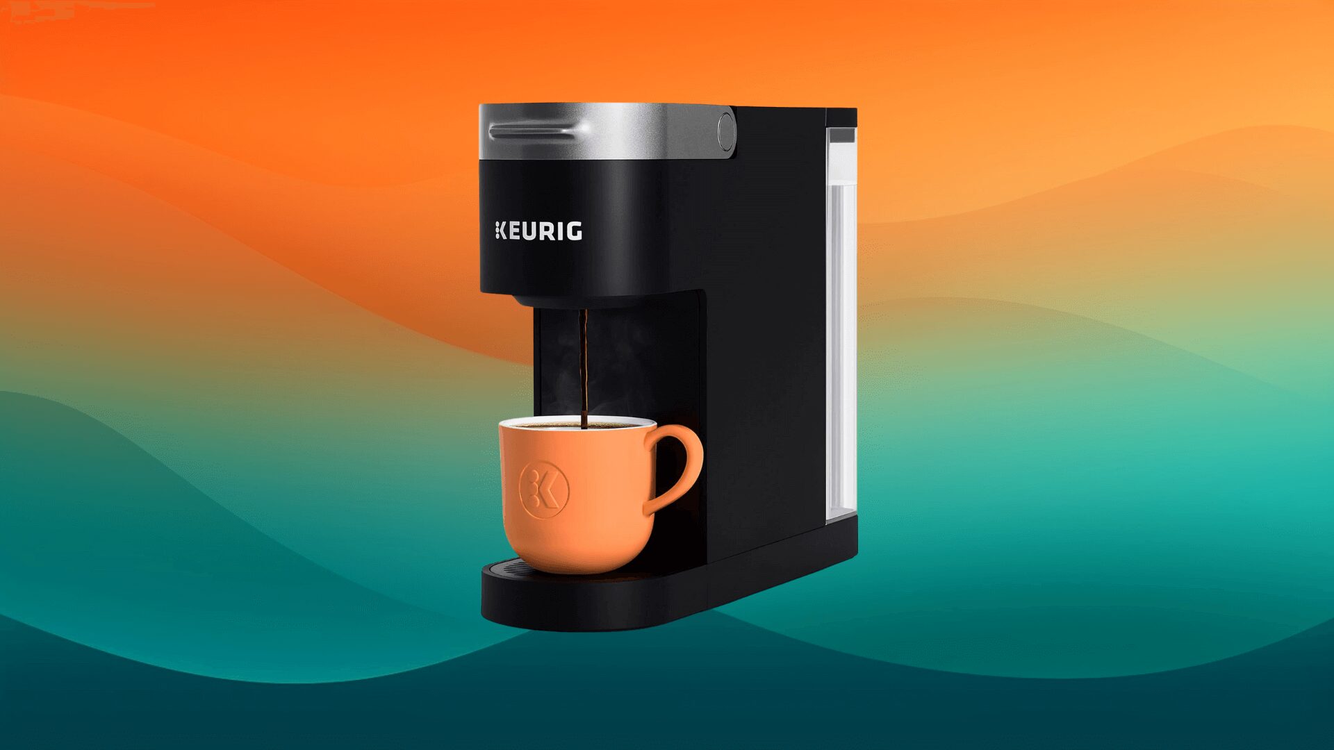 black Keruig coffee maker with an orange coffee cup underneath in front of an orange and teal background