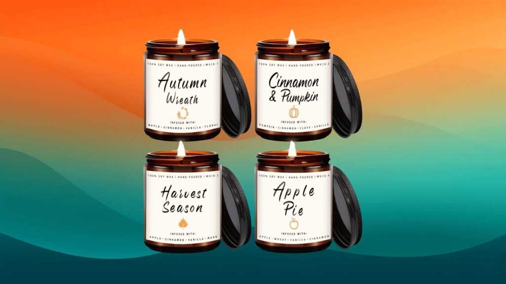 four fall scented candles in front of an orange and teal background