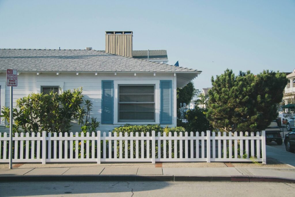 A corner house with aluminum siding.