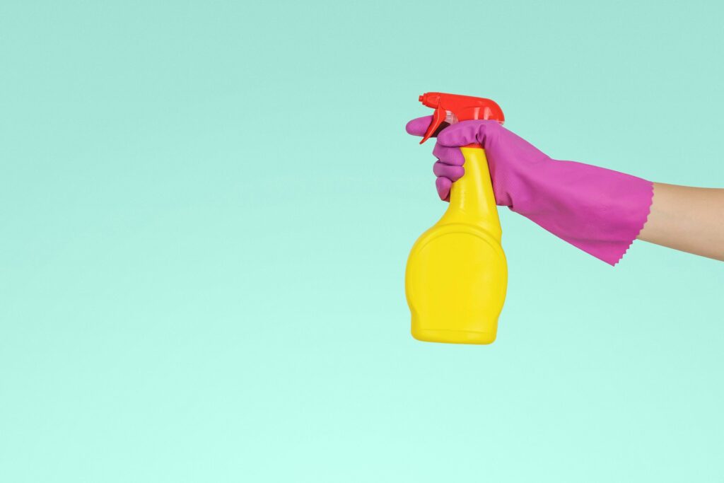 Yellow Spray Bottle With Purple Cleaning Glove