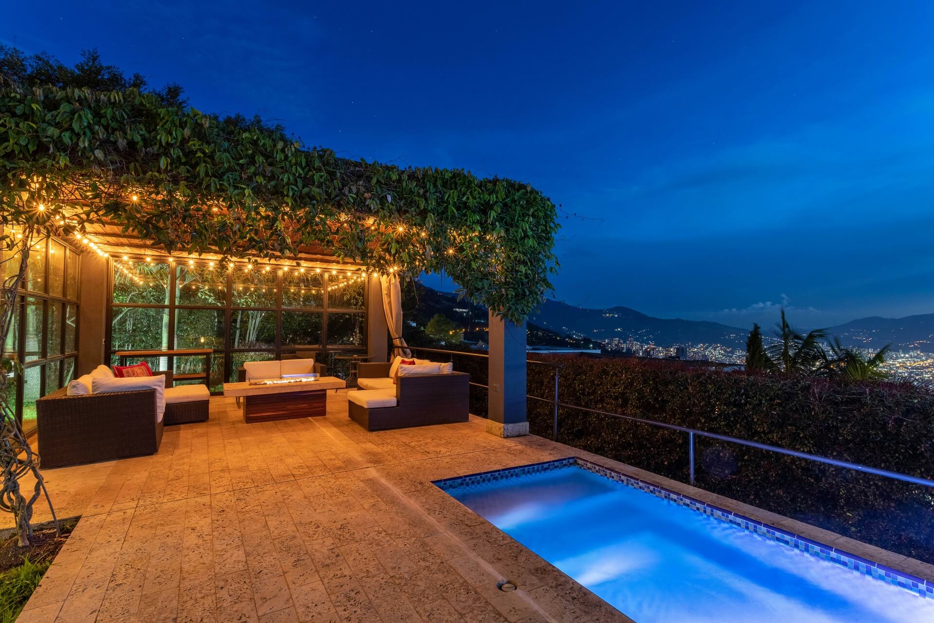 Rooftop of a bachelorette house with a seating area and pool