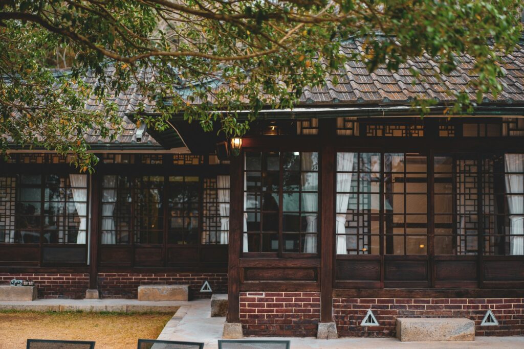 A backyard cottage with windows.