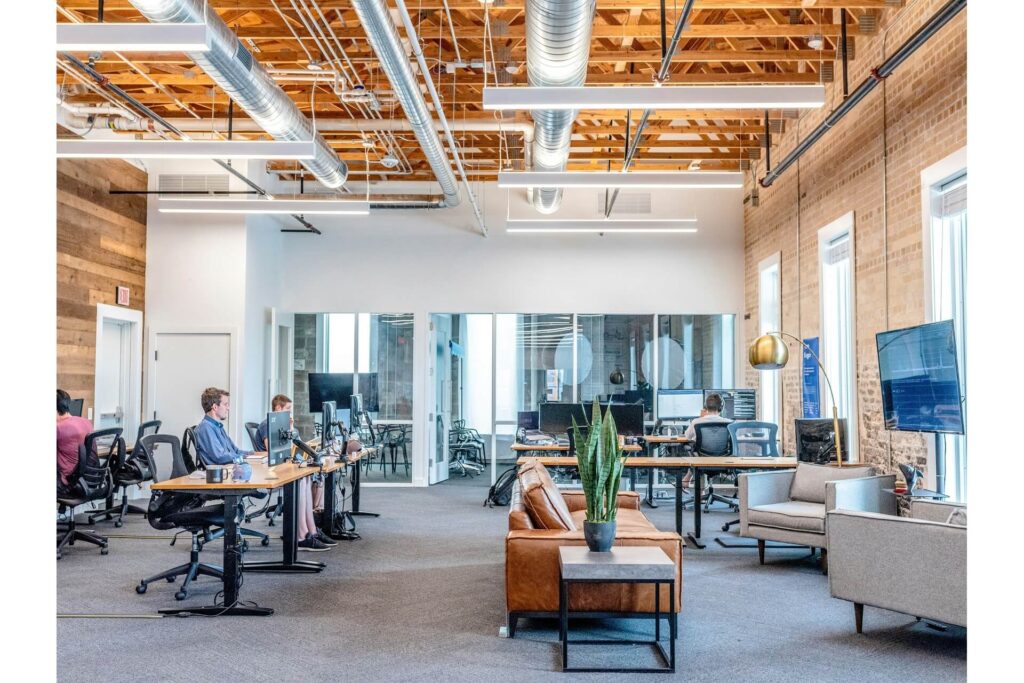 Workers sitting at their desks in a brightly lit office