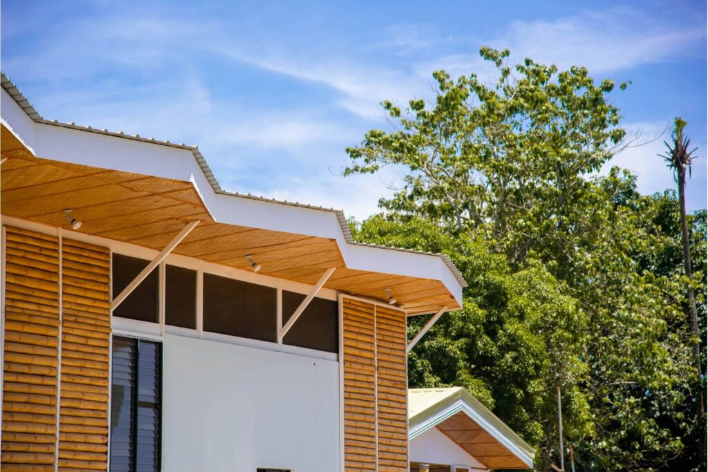 A wooden house with bamboo wall sections