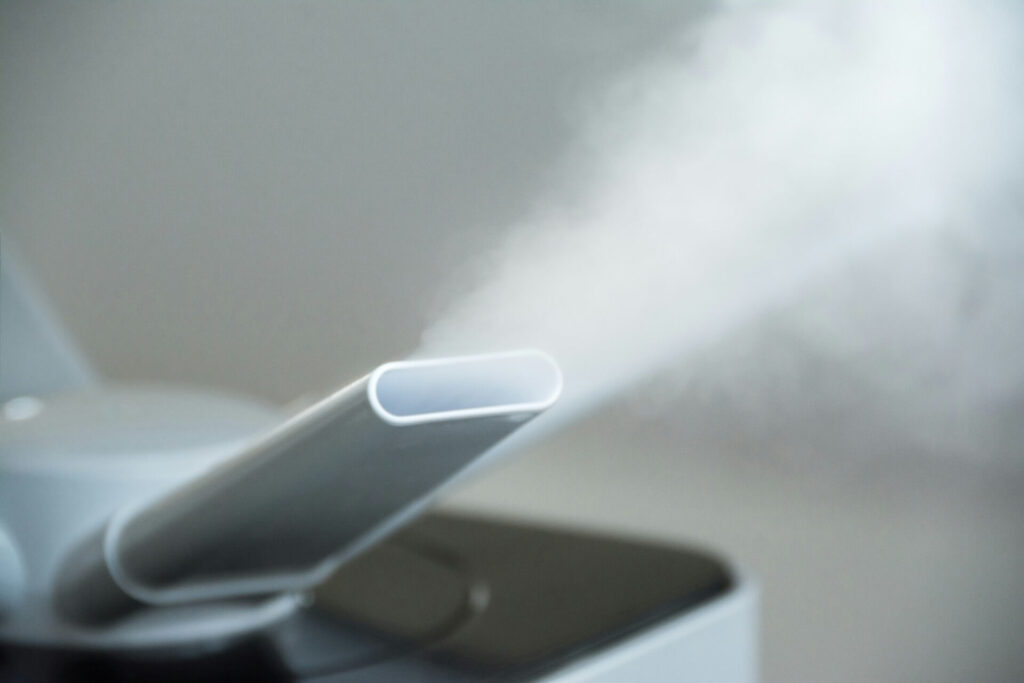 A steam cleaner emitting steam