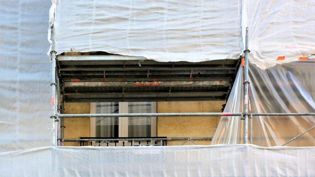 Exterior remediation will require the whole building to be wrapped in containing sheeting.