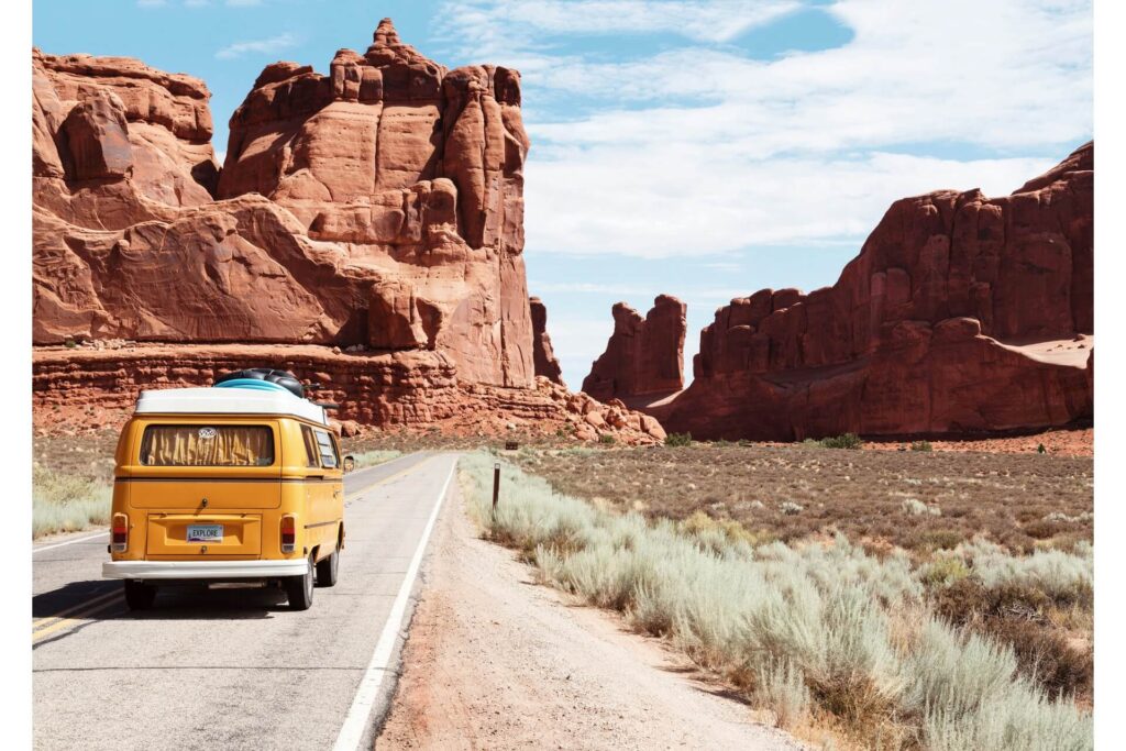 A yellow car driving in Nevada