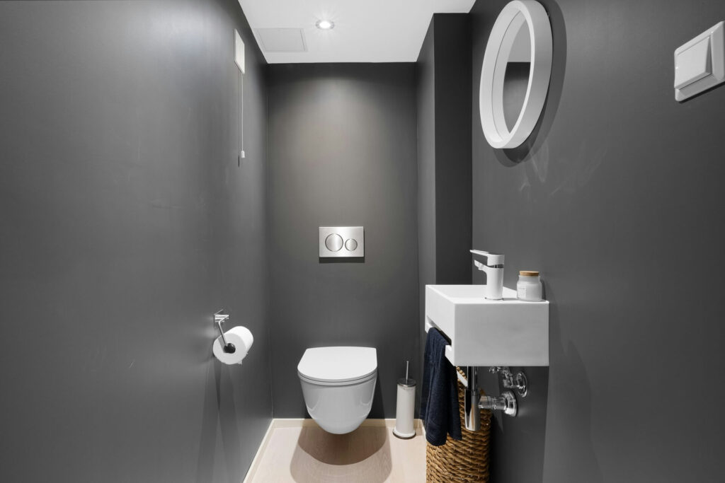 A tankless toilet in a minimalist bathroom