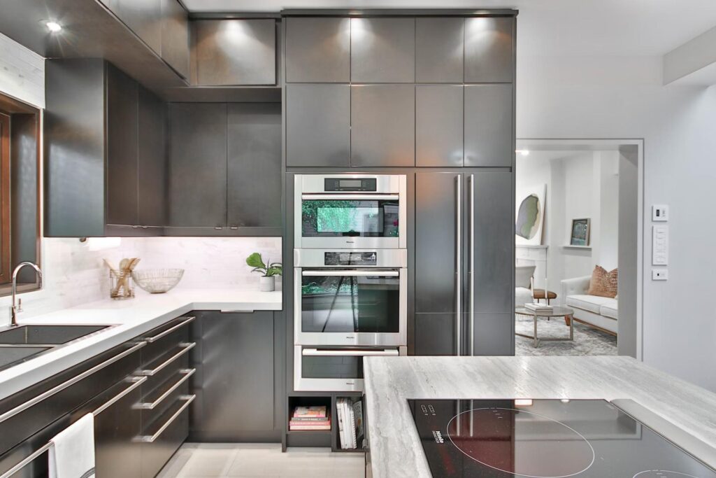 modern kitchen in silver with white walls and oven and stove
