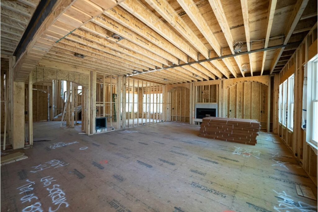 The unfinished interior of a stick-built house under construction