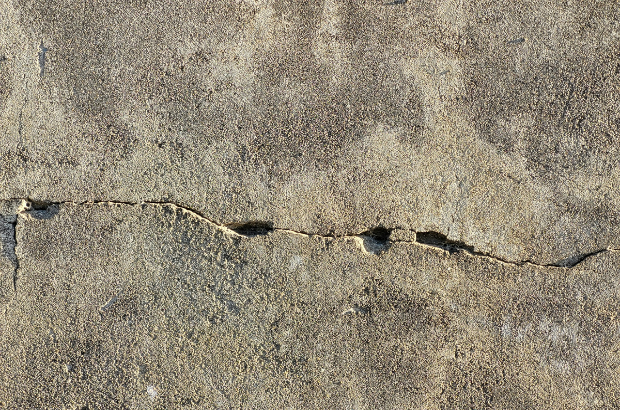 Professionals will first repair any cracks or depressions in the concrete underfloor.