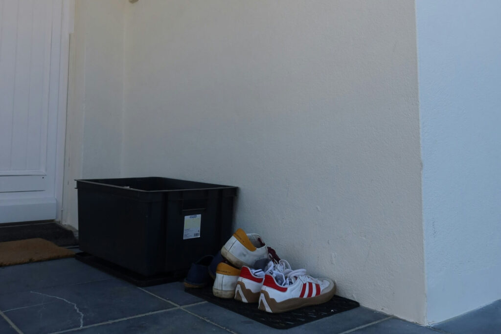Outdoor shoes left outside the house
