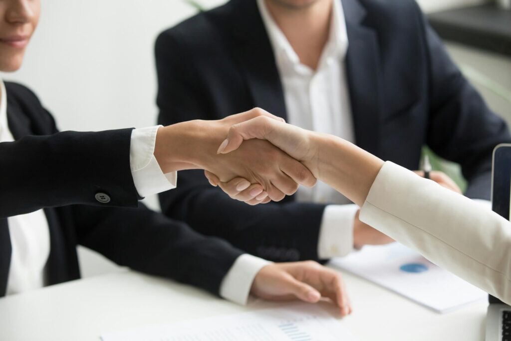 Two persons shaking hands