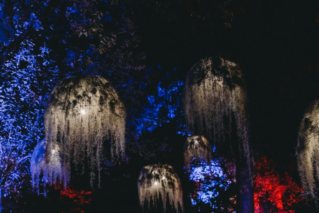 Artificial garden lights adorned with faux vegetation