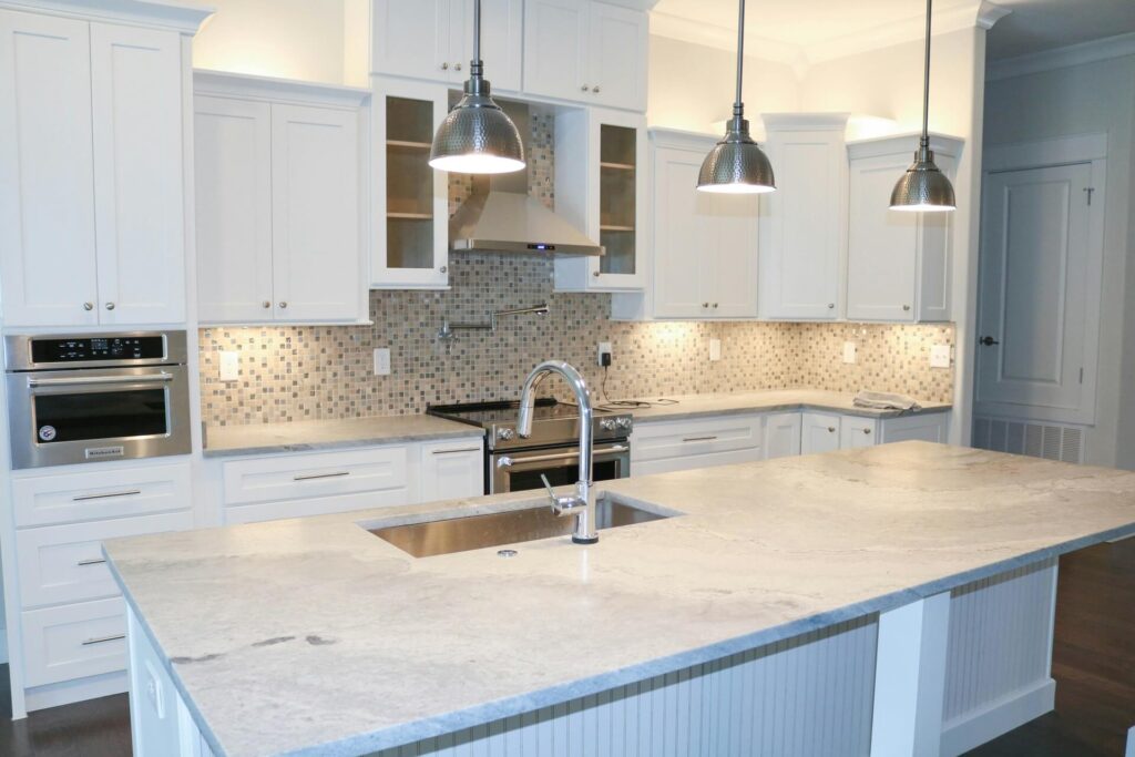 A kitchen with granite countertops