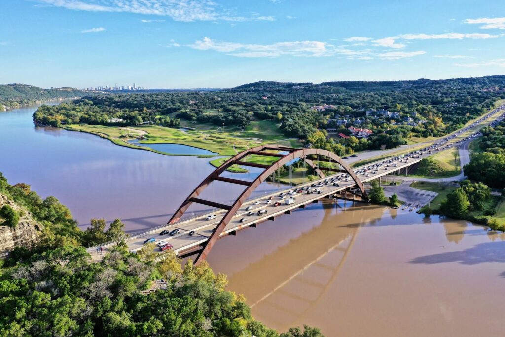 Cars driving over the Pennybacker Bridge in Austin