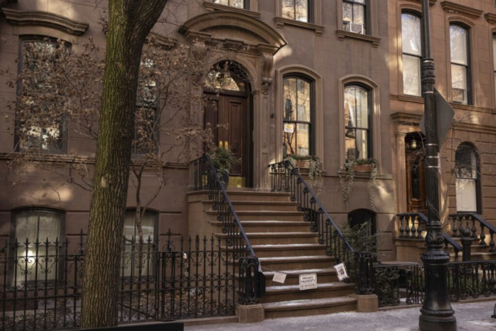 brown apartment building with stairs