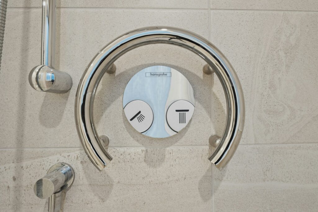 shower nob to symbolize low water pressure in the shower