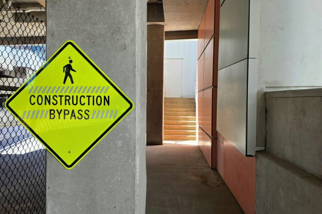 A safety sign placed at a building corridor